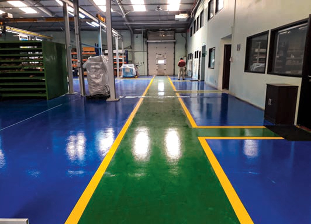 Industrial epoxy flooring with safety line markings
